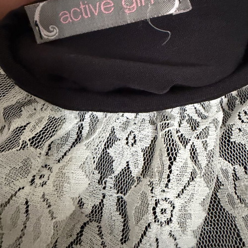 Bodysuit with lace and back opening one size like new, black and white