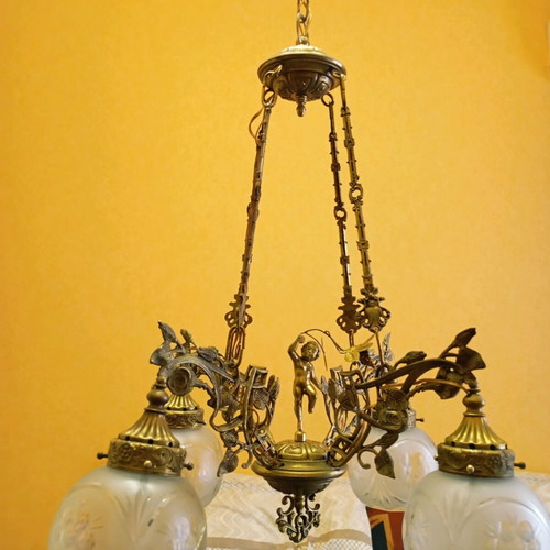 Solid brass chandelier used with crystals and putto figurine