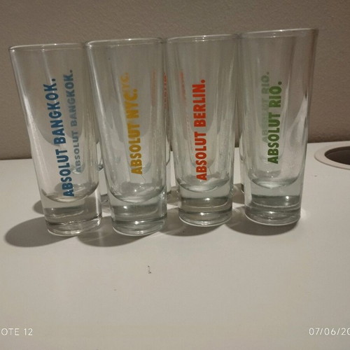 Absolut collectible shot glasses set of 8 like new