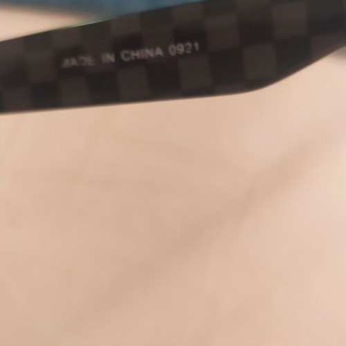 Vans sunglasses used with scratched lenses and slightly loose arms