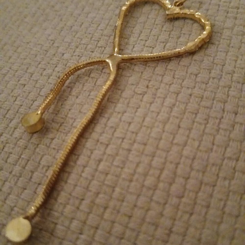 Gold heart pendant like new, gold-plated steel with rhinestones