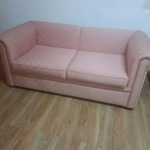 Vintage two-seater sofa used, salmon color in very good condition