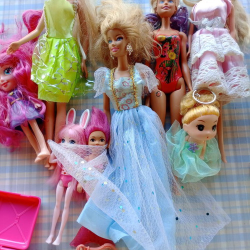 Various dolls with accessories