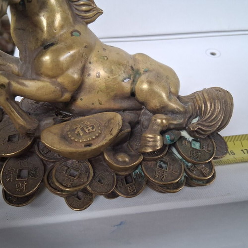 Bronze horse sculpture used, vintage wealth symbol on coins