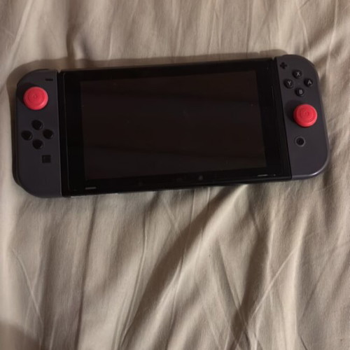 Nintendo Switch console with carrying case and Pokemon Sword game