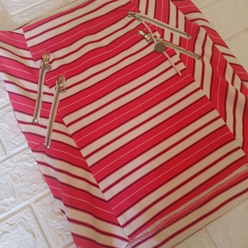 Relish skirt size 42 like new, orange with decorative zippers