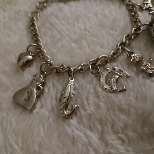 Silver bracelet with charms like new