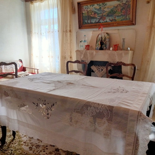 Handmade tablecloth used with knitted corners, lace and cutwork
