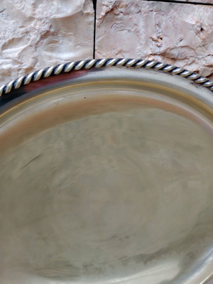 Antique brass platter used with rim and feet