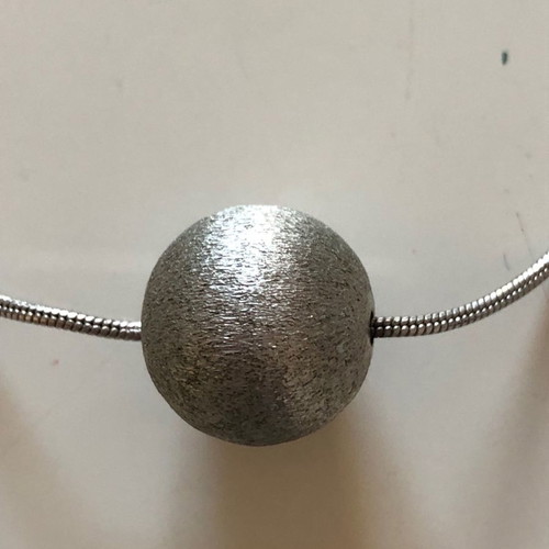 Snake chain necklace used with 5 hammered metal balls