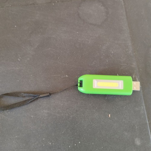 Flashlight that charges with USB new unused