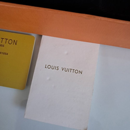 Louis Vuitton leather belt with interchangeable buckles