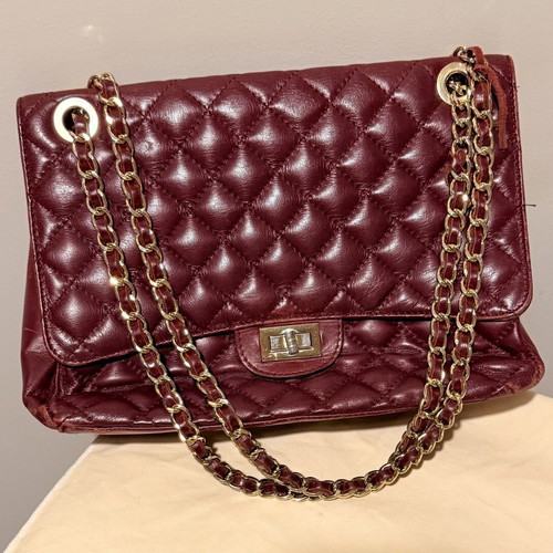 Italian leather shoulder bag used with wear on corners and chain