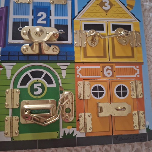 Melissa and Doug Activity Board like new, wooden with locks