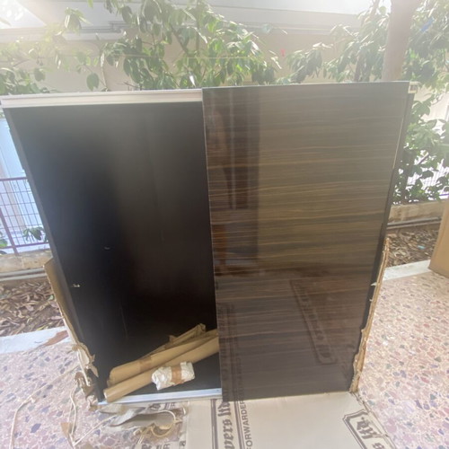 Wooden shelf unit used with adjustable shelves, dark finish