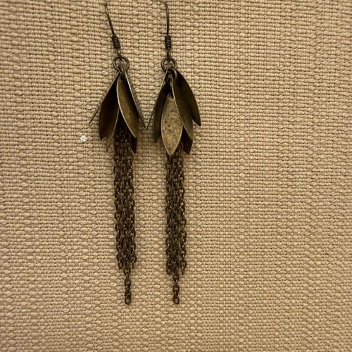 Dangling earrings lightly worn