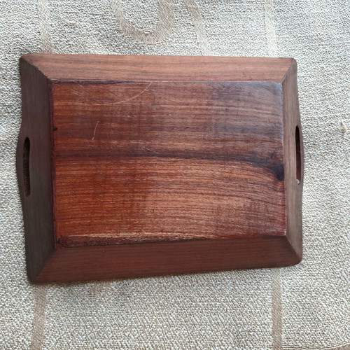 Vintage wooden serving tray used with carved floral motif