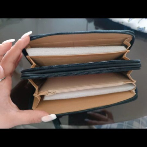 Patent leather wallet like new with embossed design and wrist strap