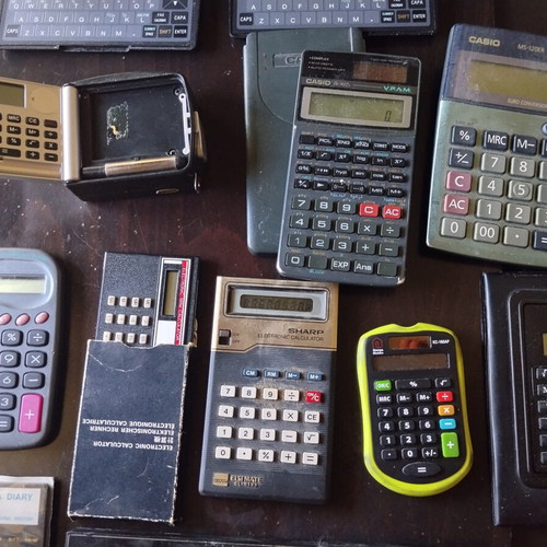 Vintage calculators and electronic organizers used, pack of 12