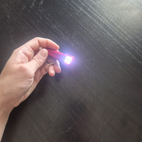 Mini LED flashlight keychain with bottle opener like new, red