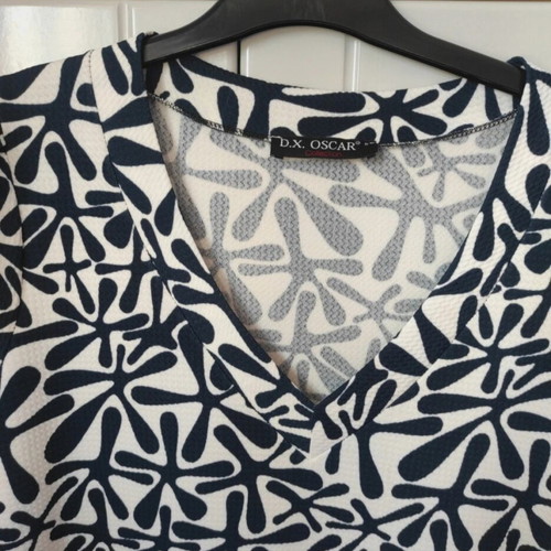 D.X. Oscar mini dress black and white with ruffles and satin detail, like new