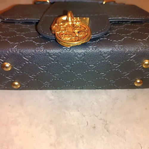 Handbag like new black with metal decoration