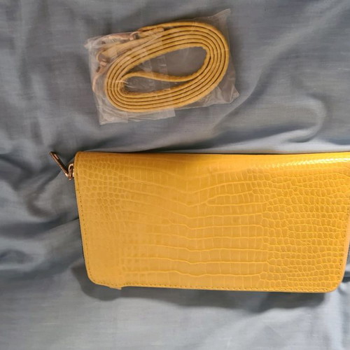 Yellow wallet used with strap