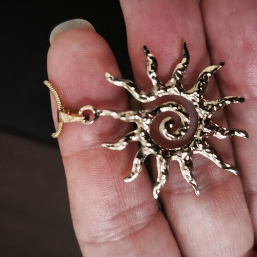 Necklace sun pendant made of stainless steel like new