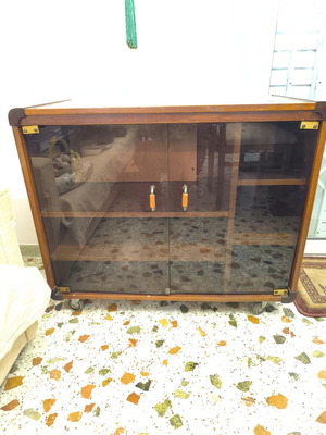 Vintage beechwood cabinet with wheels and glass doors