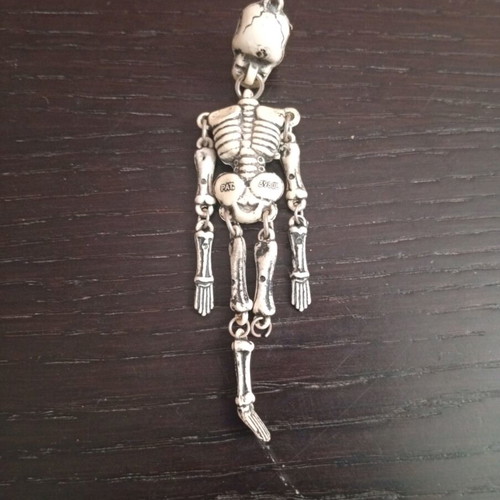 Skeleton keychain used, vintage style, white, with movable parts