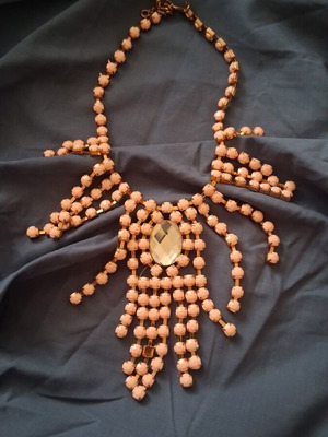 Plastic necklace with rose and gold beads, faux diamond centerpiece