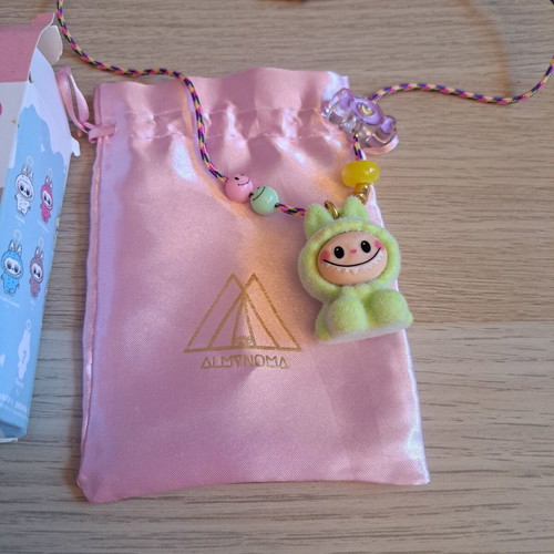 Labunoma necklace with colorful fuzzy smiling monster charm, like new
