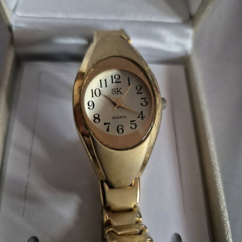 SK women's watch used, gold color