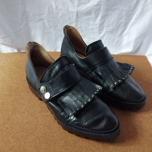 Women's black leather loafers with tassels and snap buttons, size 37