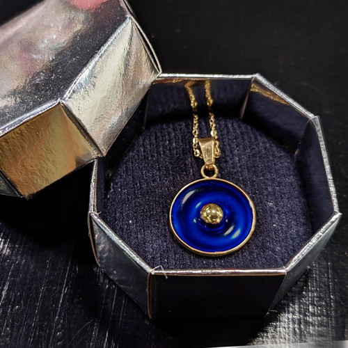 "Bleu Céleste" stainless steel handmade necklace in gold color with blue enamel.