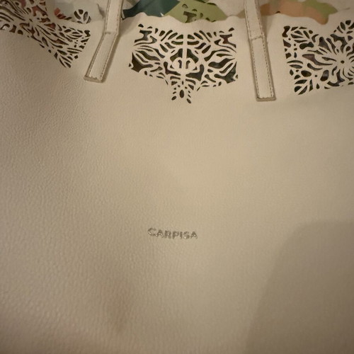 Caprisa shoulder bag used with floral inner pouch, white