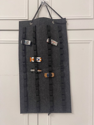 Hanging organizer for toy cars like new