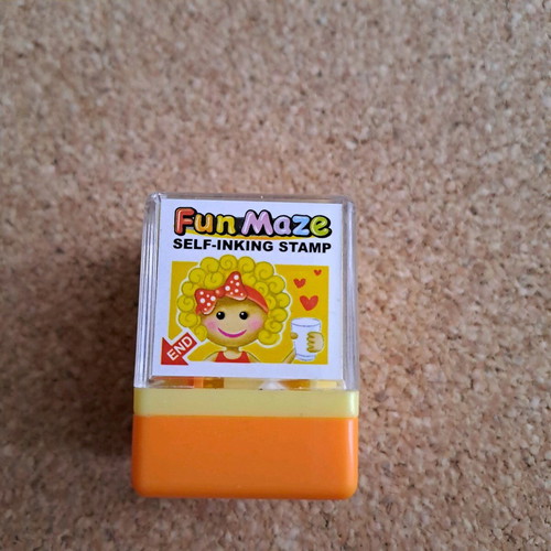 Labyrinth stamp like new, small orange with toy
