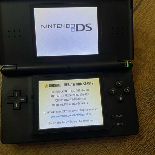 Nintendo DS Lite used, black with cartridge and original charger