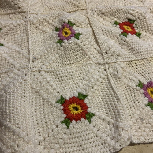 Handmade blanket used with floral crochet design