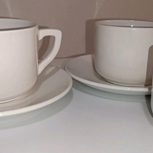 White cups and saucers set of 6 cups and 4 saucers used