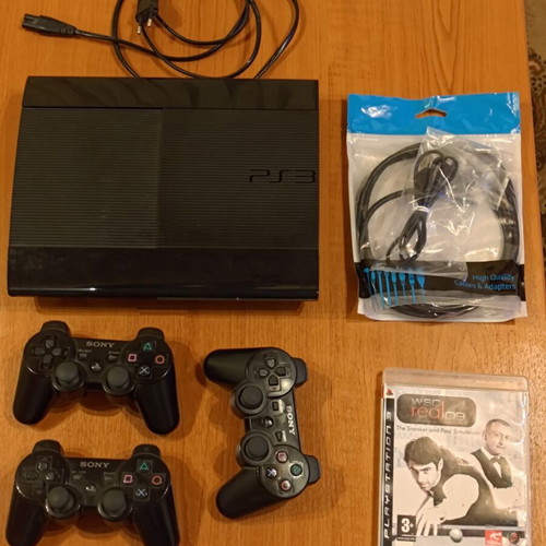 PS3 Super Slim 500GB console with three controllers and game