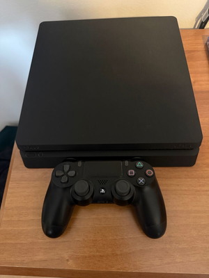 Sony PlayStation 4 Slim 1TB used with 1 controller and 9 games