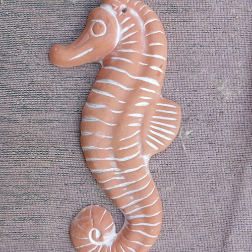 Ceramic seahorse hanging used