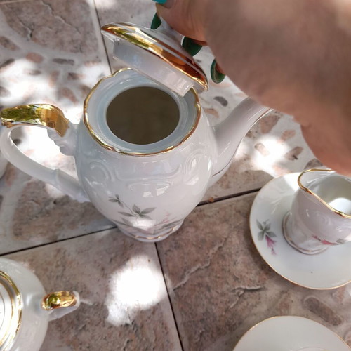 Porcelain tea set collectible with gold details and small vases like new
