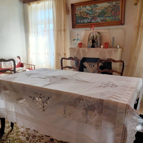 Handmade tablecloth used with knitted corners, lace and cutwork