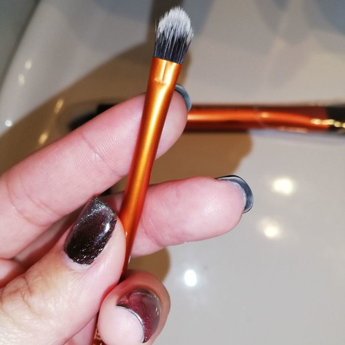 Real Techniques and Avon makeup brush set used