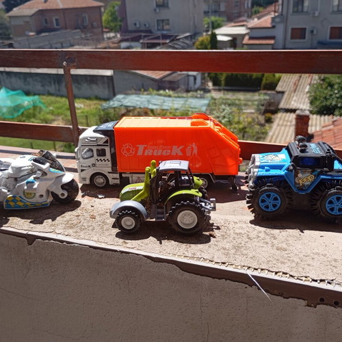 Lot of 4 used medium-sized children's toy vehicles