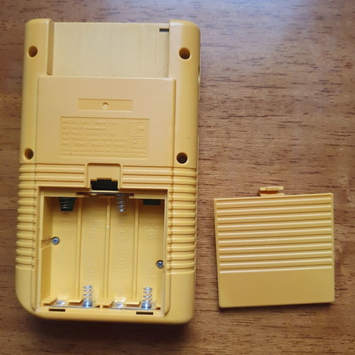 Game Boy DMG Play It Loud Edition used with Tetris cartridge
