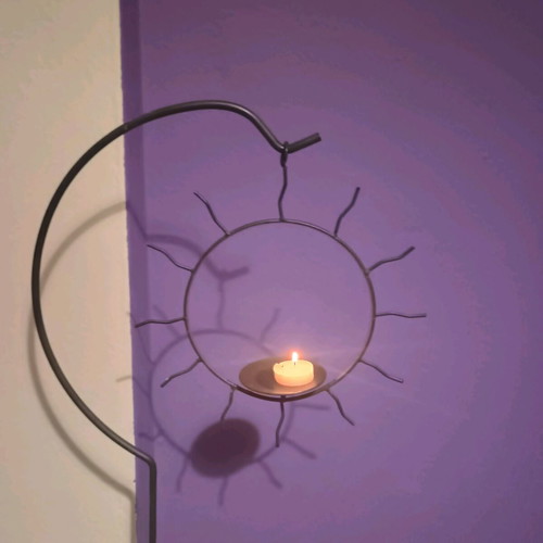 Handmade floor candlestick with hanging sun, like new, 1m height